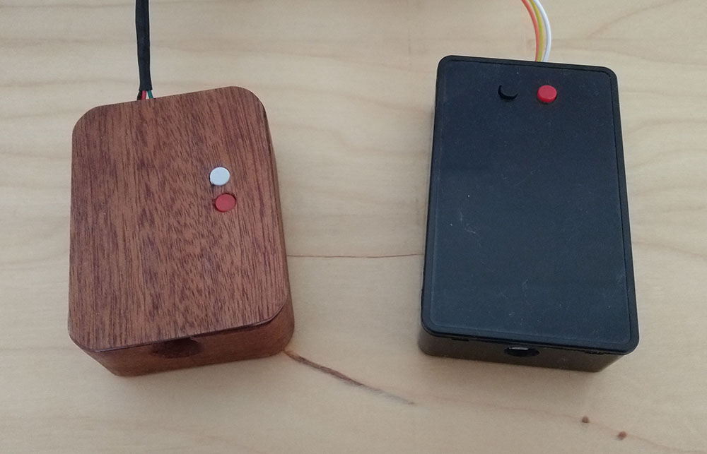 Two boxes, one wooden and one plastic, holding the electronics that powers my bottle lights