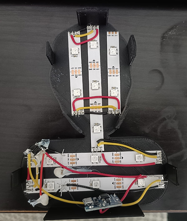 The backplate of an Electric Friend Face showing the LED strips and electronics